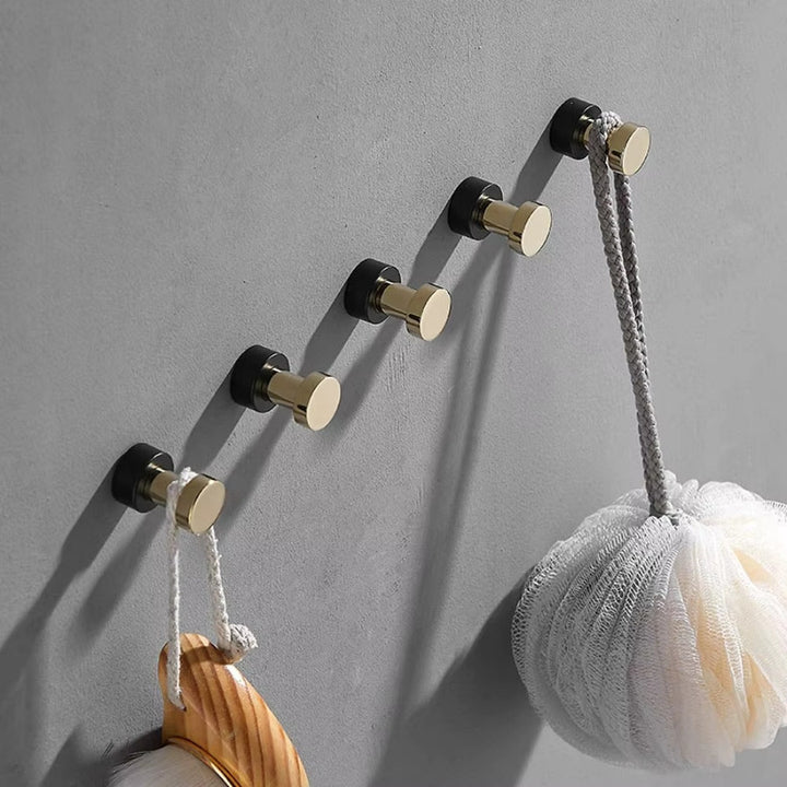 Patère murale métal ronde design moderne finition dorée et noire avec accessoires